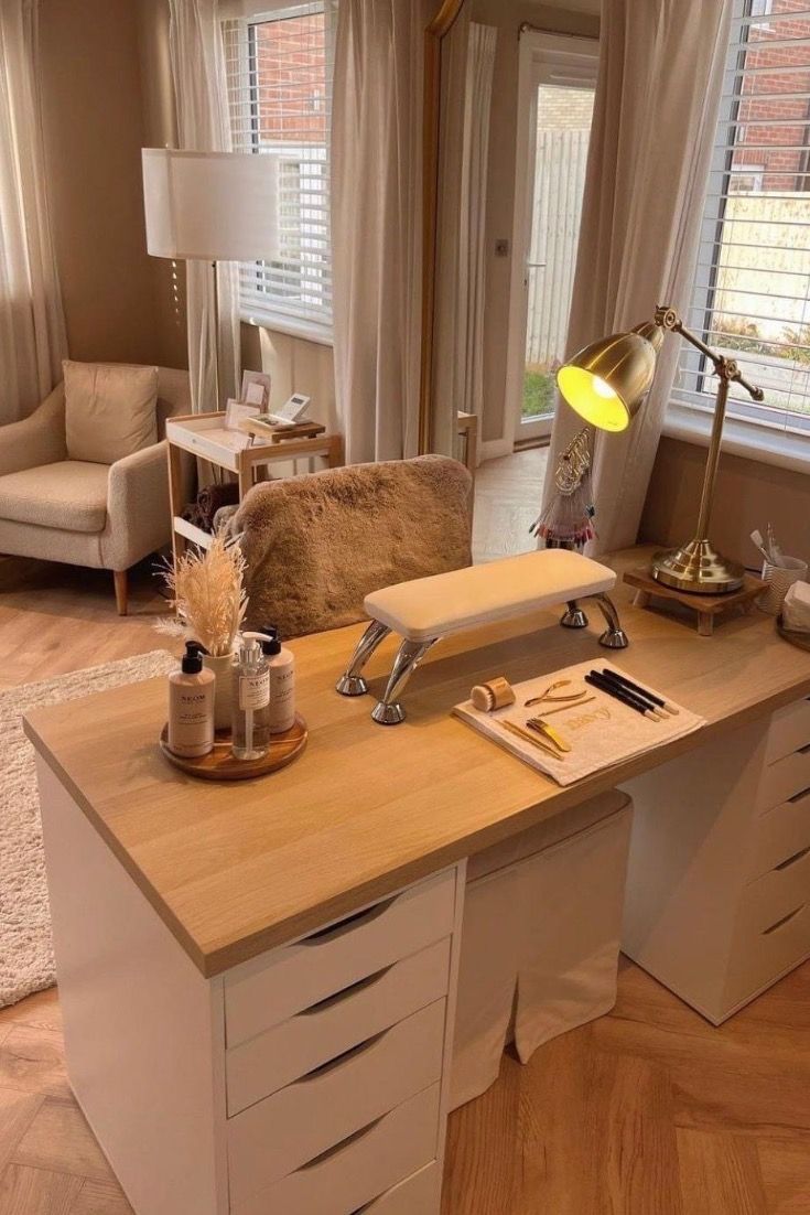 a desk with drawers and a lamp on top of it in front of a window