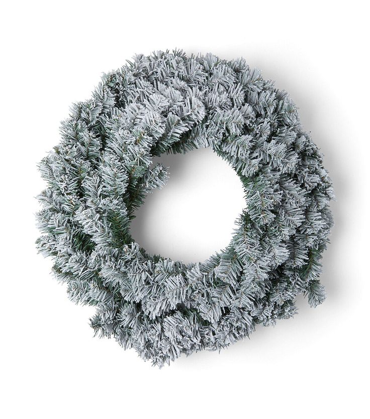 a christmas wreath is shown on a white background