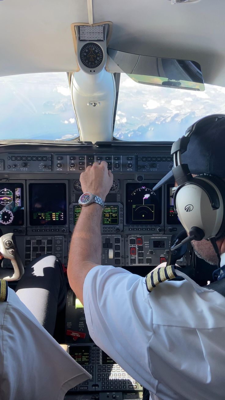 two pilots in the cockpit of an airplane