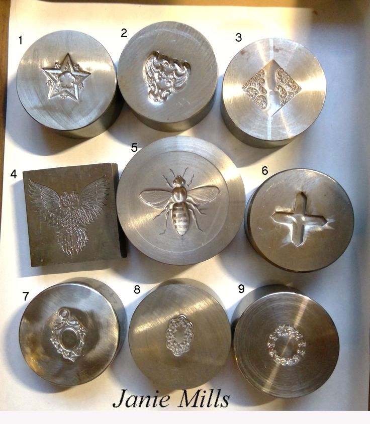 some metal plates with designs on them in a box and instructions for how to use them