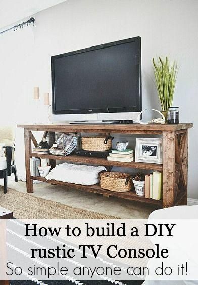 a flat screen tv sitting on top of a wooden shelf