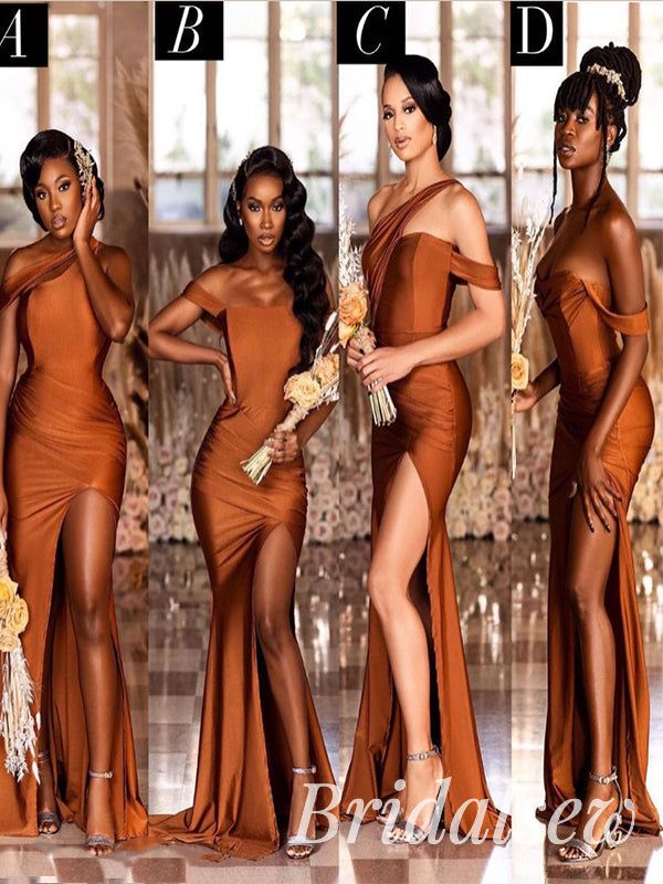 four women in different dresses posing for the camera, one is wearing an orange dress