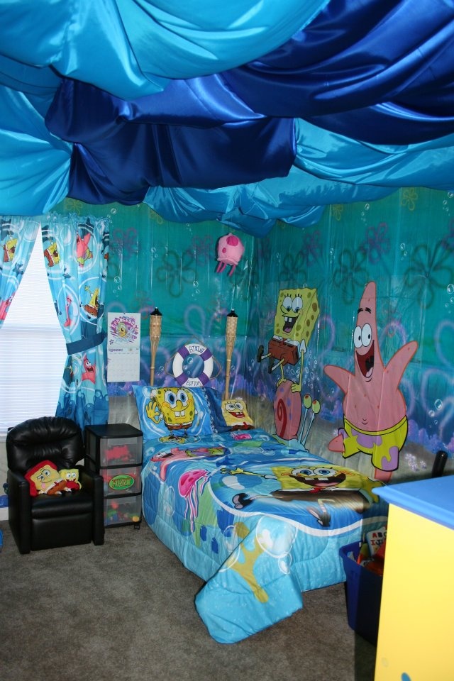 a bedroom decorated in spongebob theme with blue walls and carpeted flooring