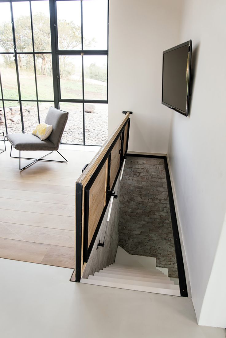 the stairs lead up to an open floor plan