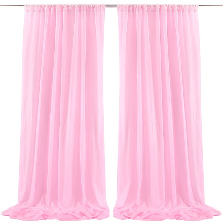 two pink curtains hanging on a metal rod