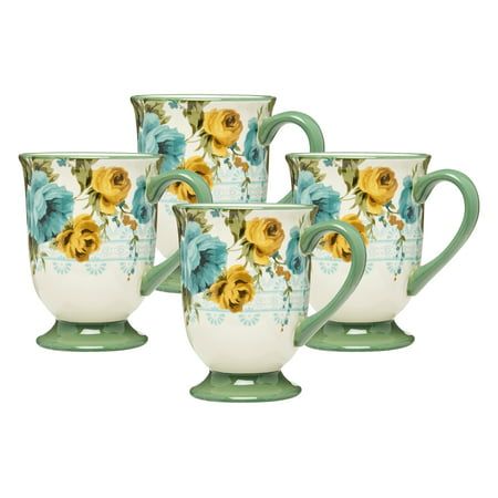 four coffee mugs with yellow and blue flowers painted on them, sitting next to each other