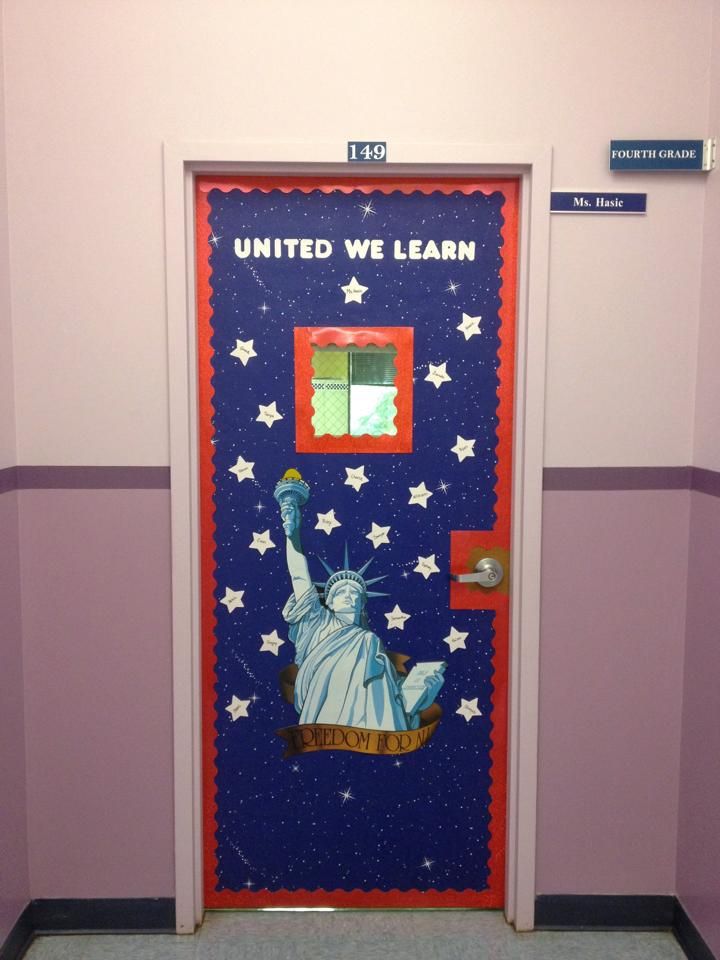 a door with the statue of liberty painted on it in front of a purple wall