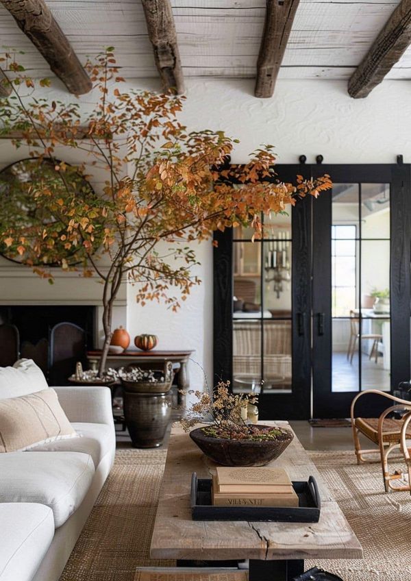 a living room filled with furniture and a fire place in front of a glass door