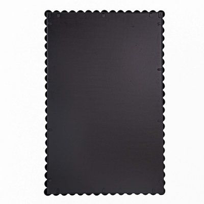 a black mat with scalloped edges is shown on a white background for use as a backdrop or wallpaper