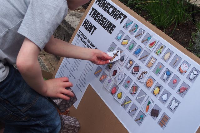 a young boy holding a toothbrush in front of a sign with magnets on it