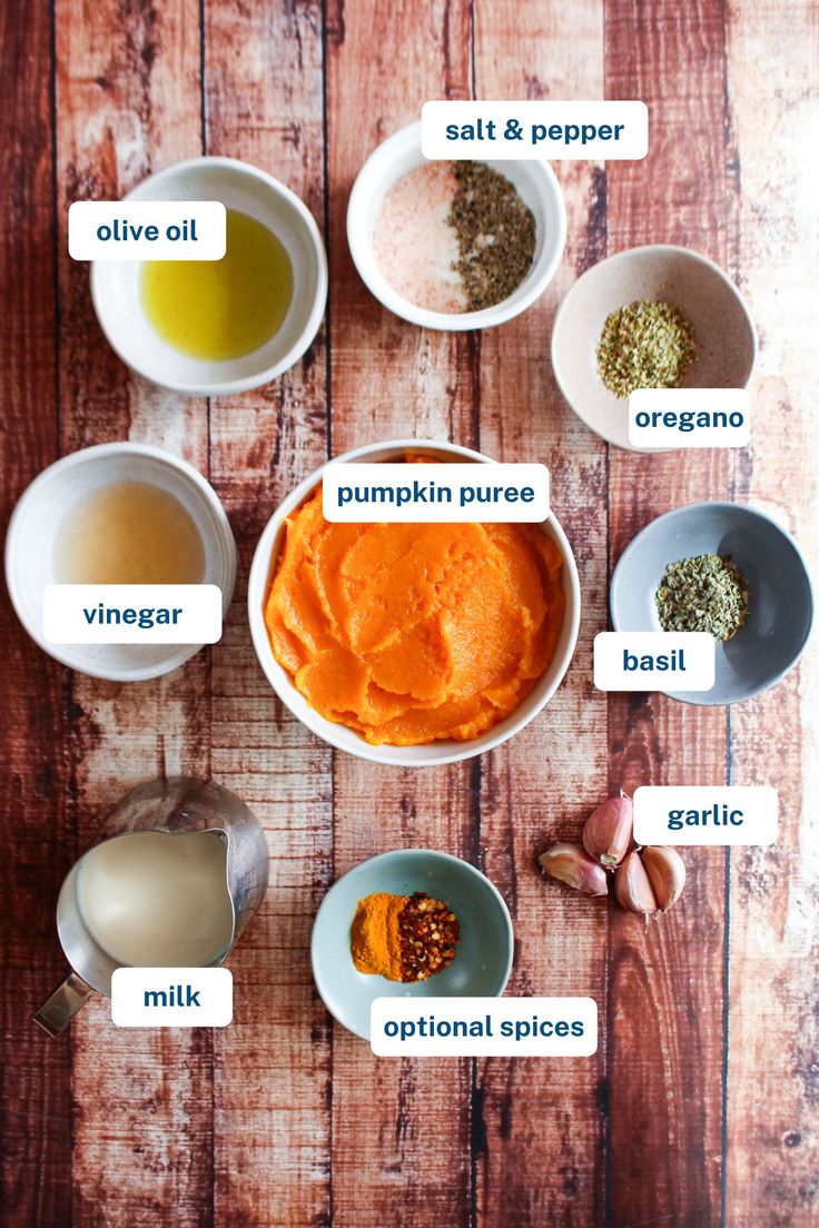 the ingredients for pumpkin puree in bowls on a wooden table