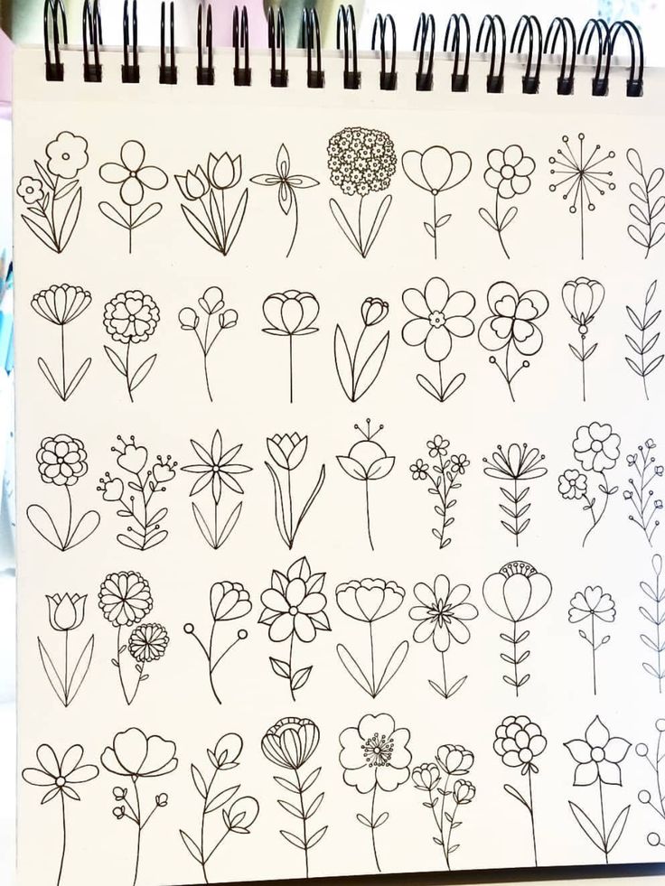 a notebook with flowers drawn on it