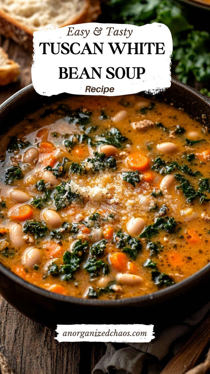 a bowl of bean soup with spinach, carrots and bread on the side