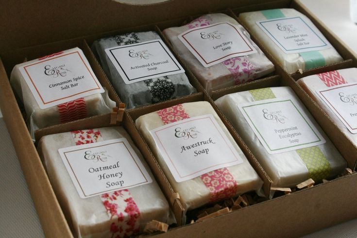 a box filled with lots of different types of soaps on top of a table