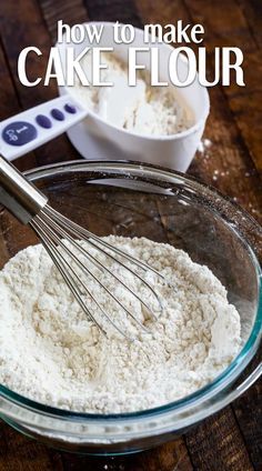 a bowl filled with flour next to a whisk on top of a wooden table