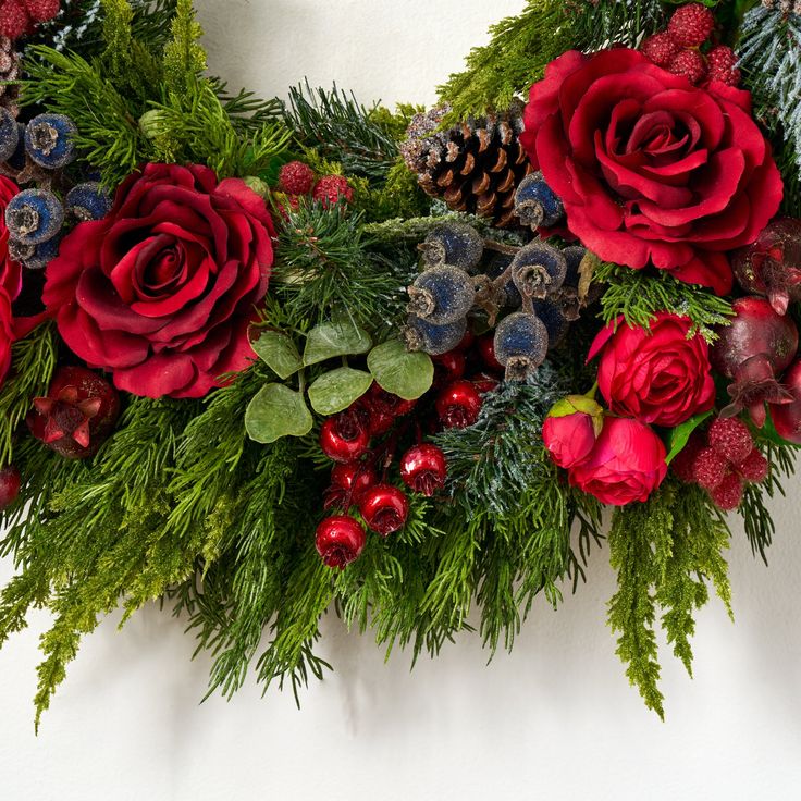 christmas wreath with red roses and greenery