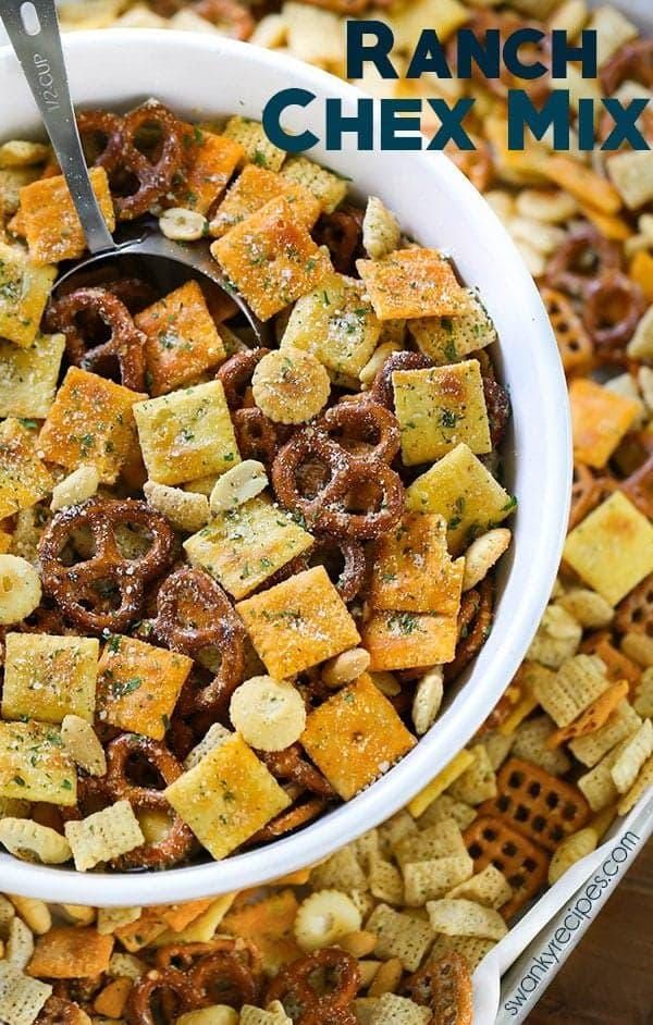 ranch chex mix in a white bowl with a spoon on top and the title above it