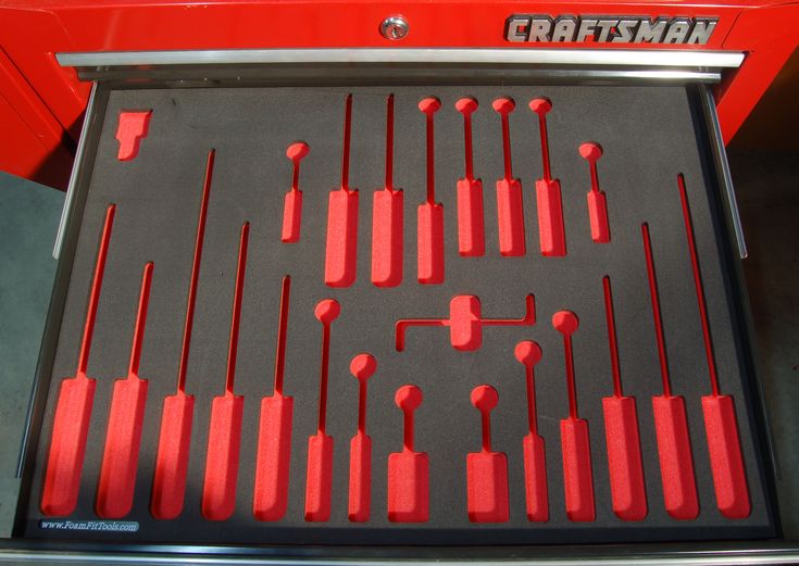 an assortment of red and black tools in a tool tray with the word craftsman on it