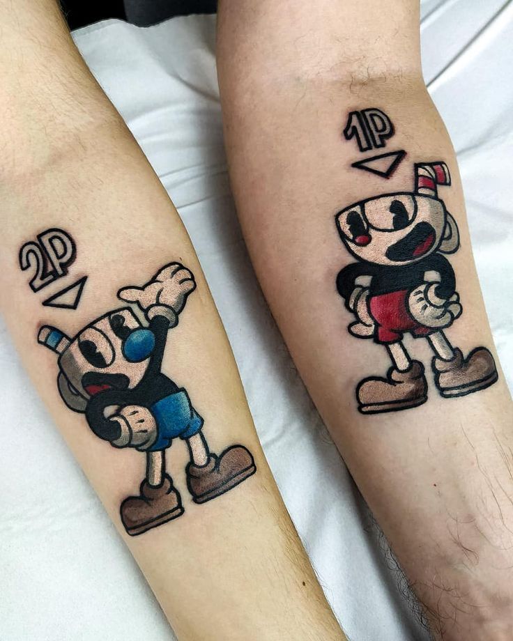 two people with matching tattoos on their arms