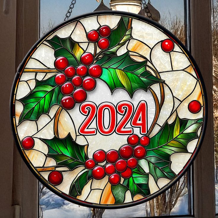 a round stained glass window with holly wreath and the number 2054 written in red