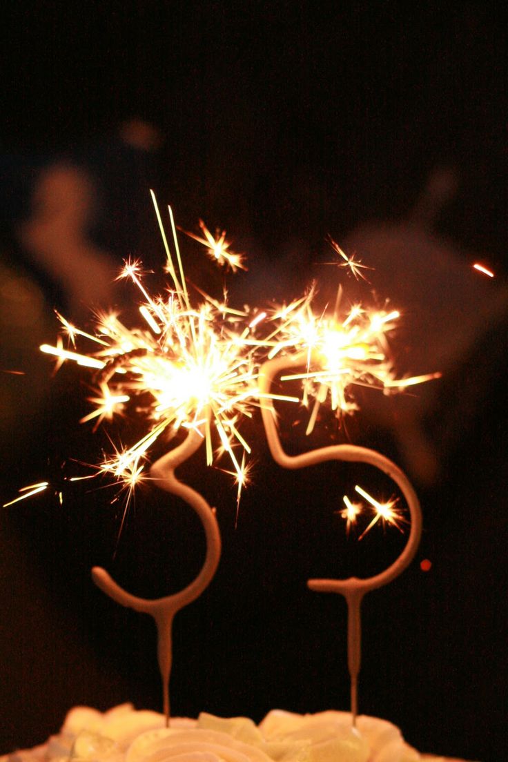 a birthday cake with sparklers on top