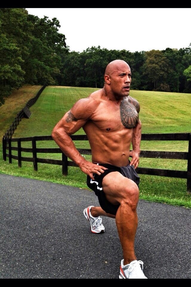 a shirtless man is running on the road