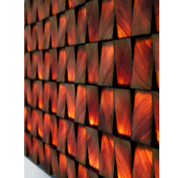 a wall made out of wooden planks with red and orange lights