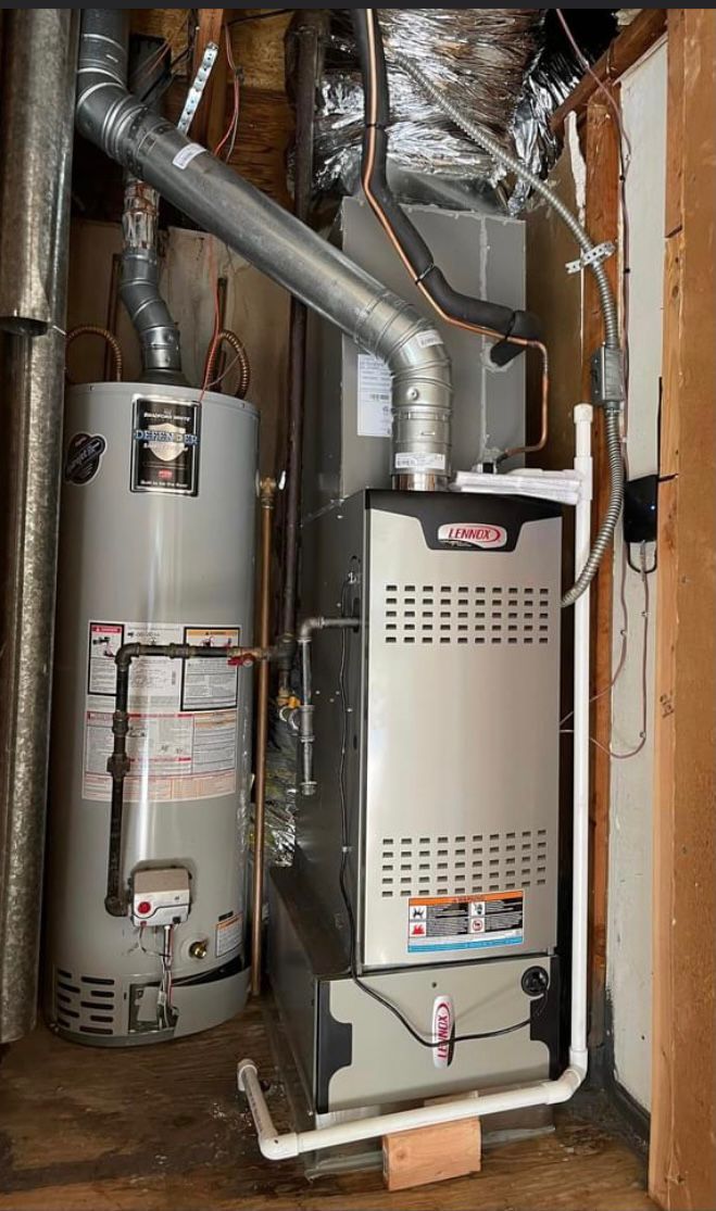 an air conditioner is in the corner of a room with exposed pipes and wires