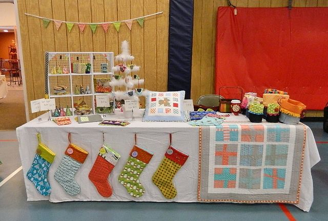 a table with stockings hanging from it's sides