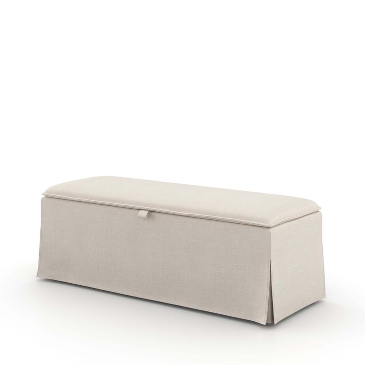 an upholstered bench with a white cover on the top and bottom, against a white background