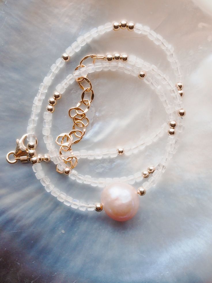 Immerse yourself in luxury with our exquisite gemstone necklace, featuring a lustrous pink freshwater pearl. Embellished with dazzling gemstones and delicate gold beads, each necklace evokes a sense of elegant paradise. ✦ Choose your Gemstone and Adjustable Length ✦ ✦ DETAILS ✦✧ Name: Akala (ah KAH la) - Pink.✧ All golden components 14kt Gold Filled.✧ Genuine Gemstones.✧ Natural Pink Freshwater Pearl.✧ Due to the nature of the gemstones and pearl, each piece may vary from the photos in size/color/shape. Every piece is gorgeous and unique.✧ All Ke Aloha Jewelry pieces come packaged thoughtfully, beautifully, and ready for gift giving.✧ Unless otherwise noted in the listing description, all pieces are sold individually. Photos with models/multiple pieces are for style inspiration only. Unique Choker Necklaces, Unique Choker, Dainty Gemstone Necklace, Floating Pearl Necklace, Gemstone Choker Necklace, Turquoise Choker, Pink Pearl Necklace, Amazonite Necklace, Gemstone Choker