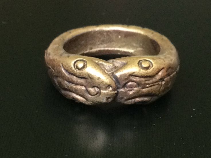 "This is a perfect and unique style magic ring made of brass metal by Lp Imm from Hua-khao temple. The power of the ring is to protect all dangers including ghost, evils and devils and the ring can bring good luck, fortune and wealth to the wearer. The ring showcases an elegant design with unique holy amulet. It is great to get this ring for your loved one or treat yourself for a classic timeless style. Amulet Name: Magic Nakabast Magic Ring Ring details: The exact benefit of the talisman and symbol means Naga lasso (Buang Nak Bas) ring Lucky amulet... Protection from danger.\" Those who own it know well the phrase, \"If you have something to eat... you won't go hungry. You eat like a snake eats its tail, and each one eats. The more you eat, the more they come together. When they hit each Ceremonial Symbolic Hand Cast Rings, Bronze Spiritual Ring Jewelry, Ceremonial Antique Finish Jewelry Ring, Ceremonial Ring With Antique Finish, Ceremonial Antique Finish Ring, Symbolic Bronze Ring Jewelry, Symbolic Bronze Ceremonial Jewelry, Symbolic Antique Finish Ring Jewelry, Ceremonial Symbolic Brass Rings