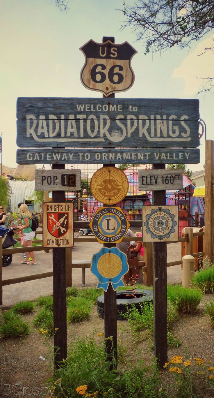 the sign for radiator springs is posted in front of a park