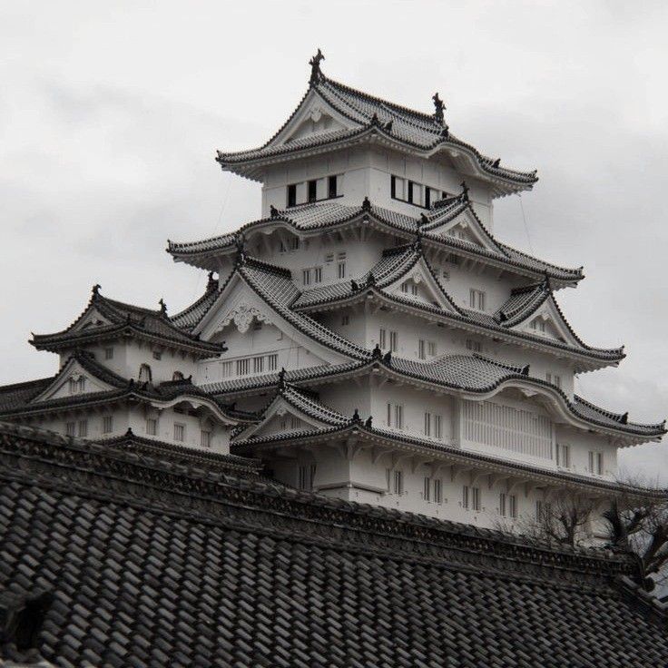 a tall white building sitting on top of a roof