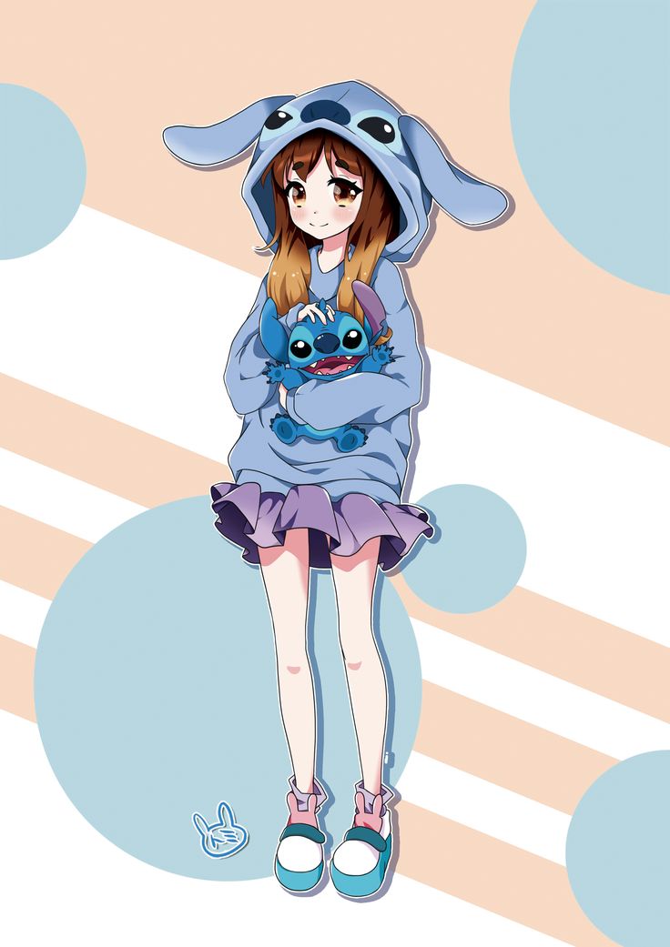 a girl in a blue hoodie is holding a cat