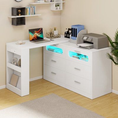 a white desk with drawers and a laptop on it