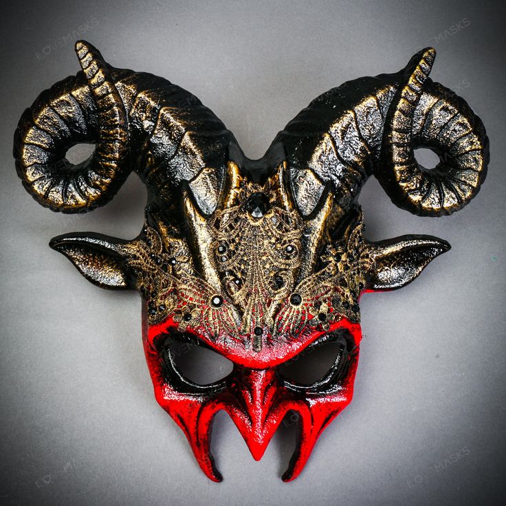 Product Description: Gear Up To Be The Center Of Attention At Your Next Halloween Or Masquerade Party With The Thrilling Krampus Ram Demon Mask! This Eye-Catching Mask Is A True Head-Turner, Adorned With Large, Curving Horns Highlighted In Gold And Painted In A Vibrant, Bloody Red That's Both Spooky And Exciting. And When The Festivities End, This Mask Transitions Into A Stunning Piece Of Wall Art, Adding A Touch Of Eerie Elegance To Any Room. Crafted From Durable Plastic, This Mask Is Carefully Krampus Legend, Demon Mask, Devil Halloween, Halloween Mask, Masquerade Party, Masquerade Ball, Gold Lace, Halloween Masks, Red Gold