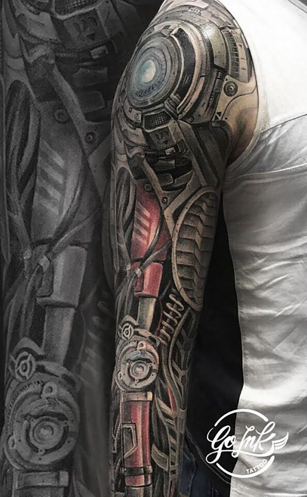 a man with a full sleeve tattoo on his arm