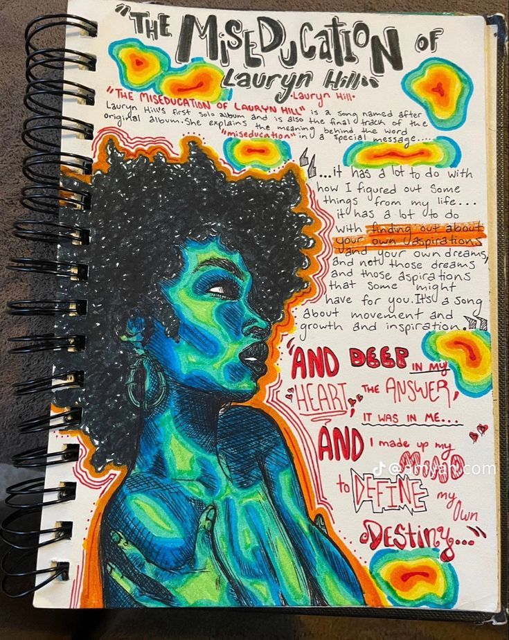 a spiral notebook with an image of a woman's face and words on it