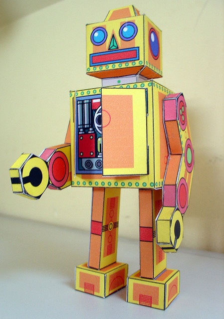 an origami robot made out of construction paper