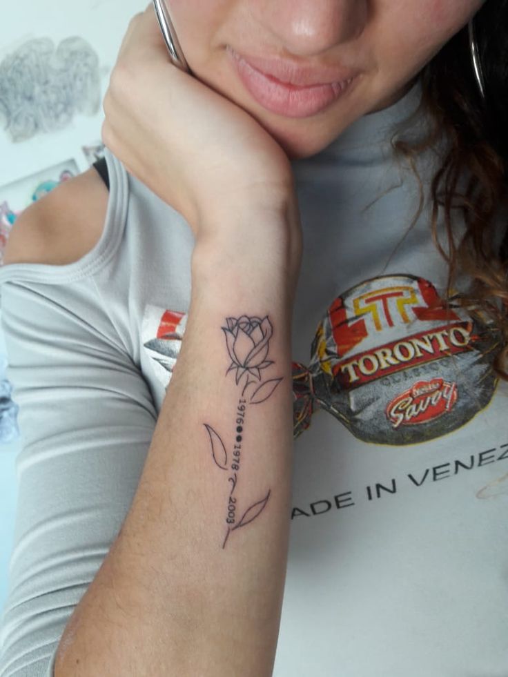 a woman with a tattoo on her arm