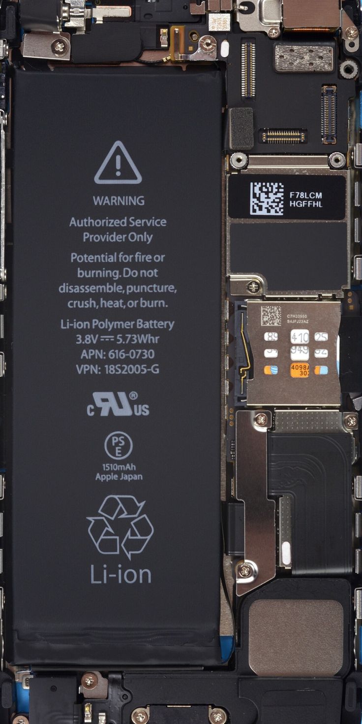 the back side of an iphone that is being dismantled