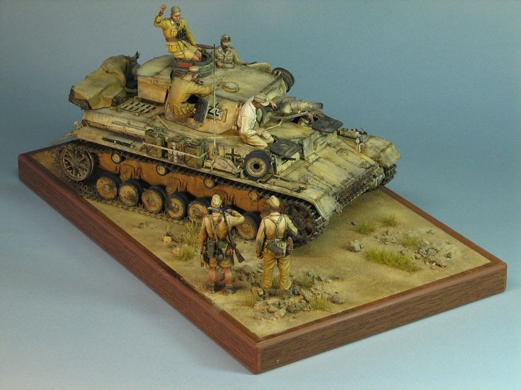 a toy model of a tank with soldiers on it