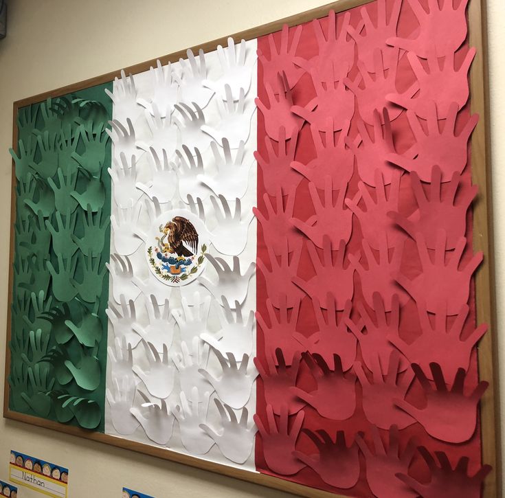 a flag made out of paper is hanging on the wall