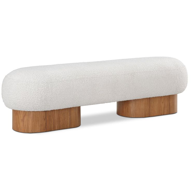 a white bench sitting on top of a wooden base