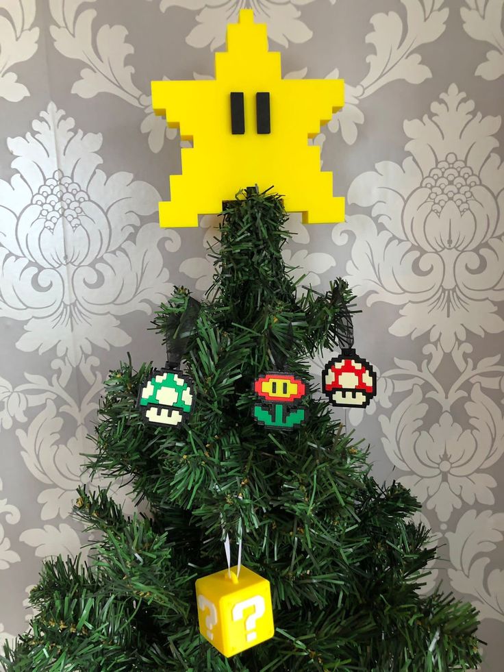 a christmas tree decorated with pacman ornaments