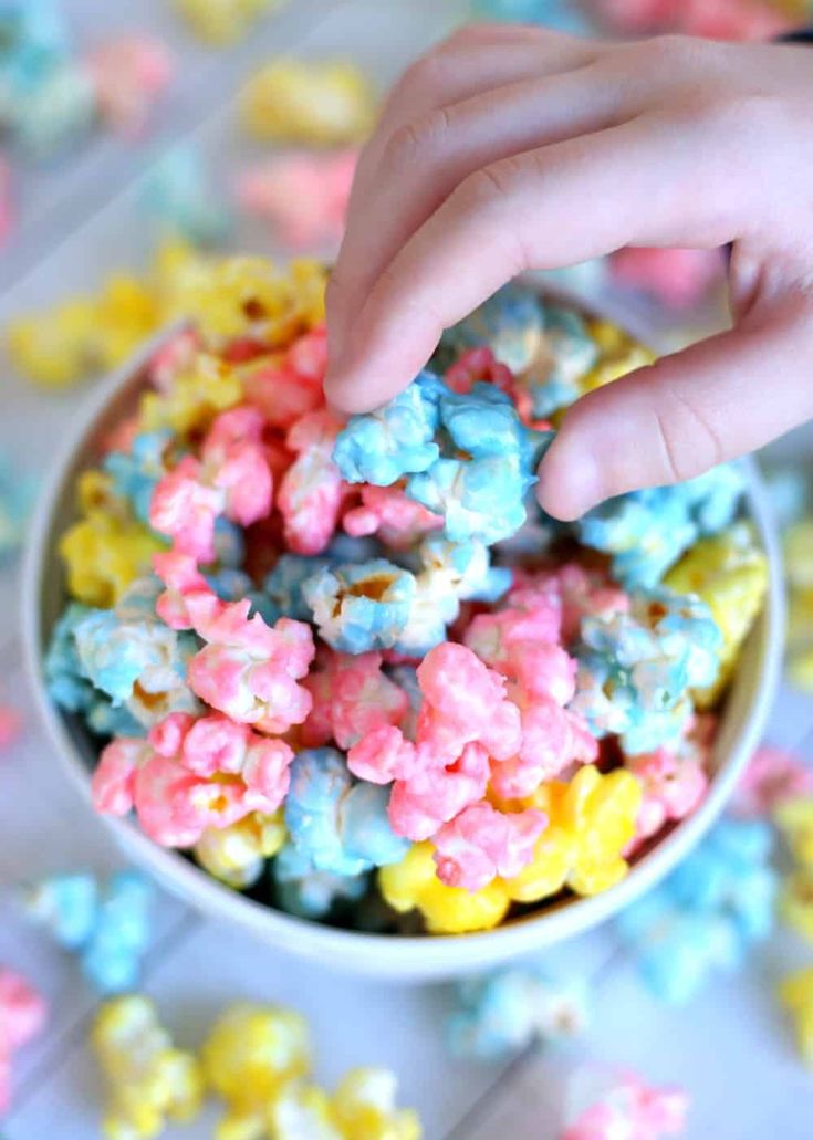 a bowl filled with colorful cereal on top of a table