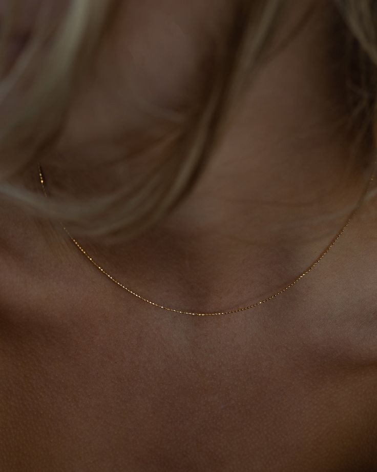 Dainty is the name, everyday wear is the game. Made in solid 14k gold, The Mini Bead Chain is the perfect for anyone that loves a minimal, clean look. Minimilastic Jewelry, Gold Chain Dainty, Simplistic Gold Jewelry, Gold Necklace Aesthetic Simple, Dainty Gold Chain Necklace, Minimal Gold Jewelry Aesthetic, Small Dainty Jewelry, Gold Jewelry Minimal, Simplistic Jewelry Aesthetic