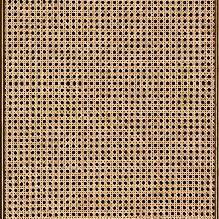 a brown and black rug with circles on it