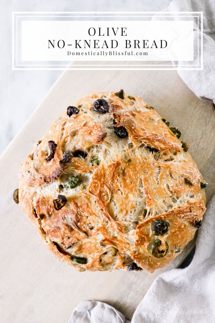 olive no - knead bread on a cutting board